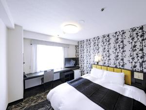 Postel nebo postele na pokoji v ubytování APA Hotel Tottori Ekimae Minami + 37 fotografií