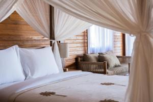 Un ou plusieurs lits dans un hébergement de l'établissement Anna Villas by Sumba-Beach