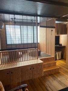 a room with a bench and some windows at Guest House Hasegawa in Sakaki +17 photos