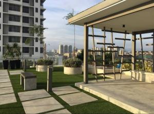 a park with benches on the roof of a building at Huge City View balcony - Netflix in Subang Jaya
