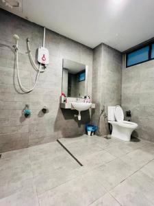 a bathroom with a shower and a toilet and a sink at Huge City View balcony - Netflix in Subang Jaya