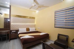 Postel nebo postele na pokoji v ubytování Hotel Royce Executive Near US Consulate, Bandra Kurla Complex