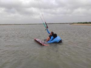 two people are on a board in the water at Scoop Cabana Kitesurfing in Kalpitiya +57 photos