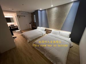 Ein Bett oder Betten in einem Zimmer der Unterkunft One Roll Stone Homestay