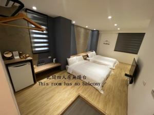 Ein Bett oder Betten in einem Zimmer der Unterkunft One Roll Stone Homestay