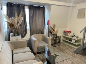 Χώρος καθιστικού στο Chambre charmante