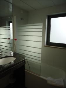 Um banheiro em Hotel Jose Alberto