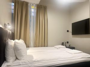 Postel nebo postele na pokoji v ubytování Hotel Hötorget