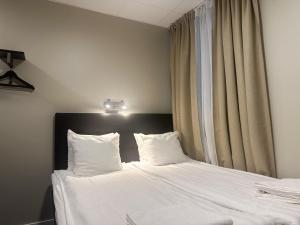 Postel nebo postele na pokoji v ubytování Hotel Hötorget