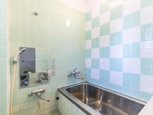 Koupelna v ubytování Tabist Hara Business Ryokan