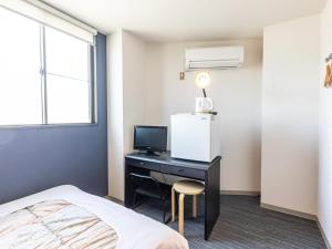 Postel nebo postele na pokoji v ubytování Tabist Hara Business Ryokan