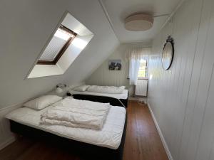 Postel nebo postele na pokoji v ubytování Saltögården