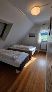Postel nebo postele na pokoji v ubytování Saltögården
