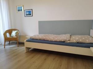 Ένα ή περισσότερα κρεβάτια σε δωμάτιο στο Fewo-Annegret