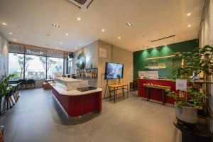 Daegu Eastern Hotel Lions Park的电视和/或娱乐中心