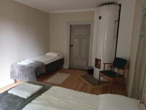 Postel nebo postele na pokoji v ubytování Kungsgården BnB