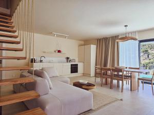 a living room with a couch and a table at Villa Artemis II in Žman