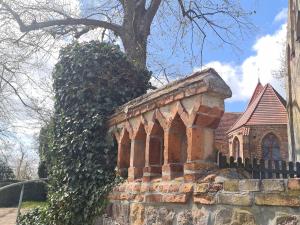 a brick building with a tree on top of it at Garten-Ferienhaus Biendorf OT Westenbrügge in Uhlenbrook +33 photos