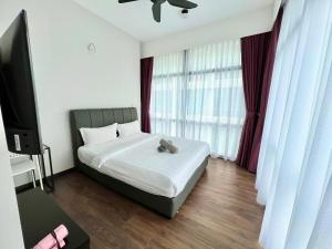 Postel nebo postele na pokoji v ubytování Margo Hotel Kota Kinabalu