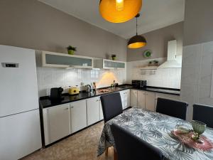 a kitchen with a table and a dining room at Dream Laguna 3 in La Laguna