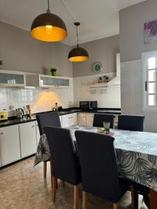 a kitchen with a table and chairs in a kitchen at Dream Laguna 3 in La Laguna +19 photos