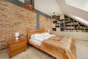 Posteľ alebo postele v izbe v ubytovaní Jasny Dwupoziomowy Apartament we Wrocławiu by Noclegi Renters