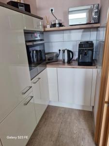 Kuchyň nebo kuchyňský kout v ubytování Apartment Bochum