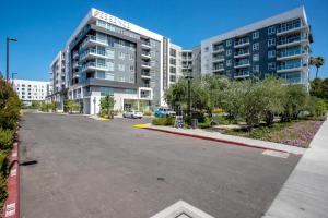 an empty parking lot in front of a building at Woodland Hills Studio w Gym Pool nr 101 LAX-830 in Los Angeles