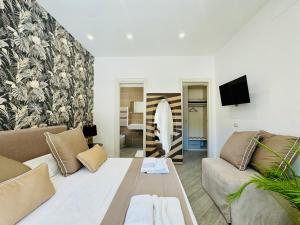 a living room with a couch and a table at YourHome - Santa Lucia Rooms in Sorrento
