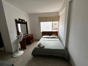 Postel nebo postele na pokoji v ubytování Hotel el Recuerdo