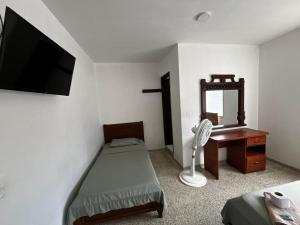 Postel nebo postele na pokoji v ubytování Hotel el Recuerdo