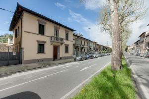 a street with cars parked on the side of the road at Bice & Krizia Apartments by Mamo Florence in Florence