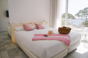 Postel nebo postele na pokoji v ubytování Hotel Aromar