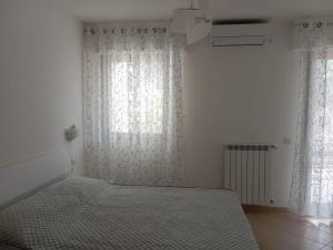 Postel nebo postele na pokoji v ubytování B&B Guesthouse La Casetta Di Sutri sulla Francigena
