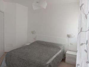 Postel nebo postele na pokoji v ubytování B&B Guesthouse La Casetta Di Sutri sulla Francigena