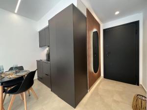 a room with a table and a black partition at BlueMotion - PortSuite 5A in Piraeus
