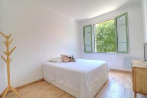 Кровать или кровати в номере Joli appartement en bord de mer