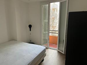 Кровать или кровати в номере Joli appartement en bord de mer