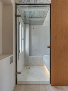 Cama ou camas em um quarto em Ammoa Beach Residences