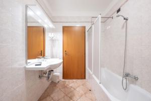 a bathroom with a sink and a shower at Residence Desiree in Riva del Garda