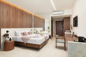 Postel nebo postele na pokoji v ubytování Elia Sea Suites