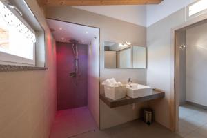 a bathroom with a sink and a shower at Residence Desiree in Riva del Garda