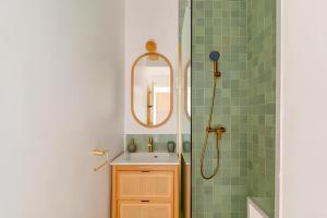 a bathroom with a sink and a shower at Charming apartment with Cosy Balcony Old Port in Marseille