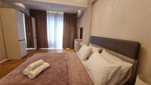Katil atau katil-katil dalam bilik di Azure Premium by Bakuapart