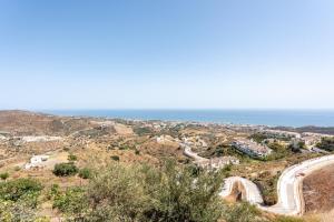 an aerial view of a road and the ocean at Cortijo Ariza Sea Views in Málaga +38 photos