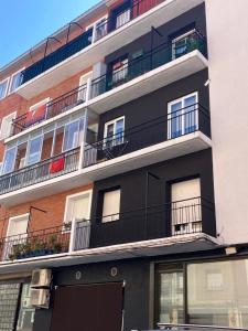 an apartment building with balconies on the side of it at Virgen del Rio in Pamplona