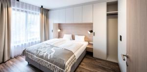 Postelja oz. postelje v sobi nastanitve PRIVATE HOMES Alpin Spa Apartments