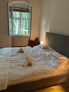 Postel nebo postele na pokoji v ubytování Ferienwohnungen in Reichenau