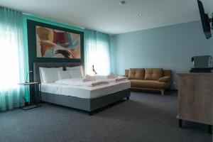 Postelja oz. postelje v sobi nastanitve Kirchenwirt Stubenberg Kunsthotel