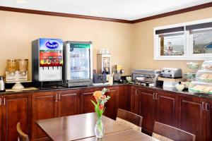 a coffee shop with a table and a drink machine at Quality Inn Port Angeles - near Olympic National Park in Port Angeles